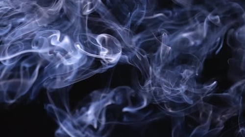 Abstract Blue Smoke Flowing on Black Background