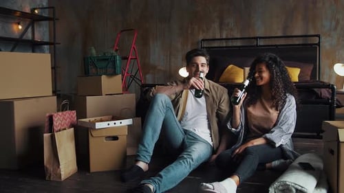 Male and Female Moving to a New Apartment