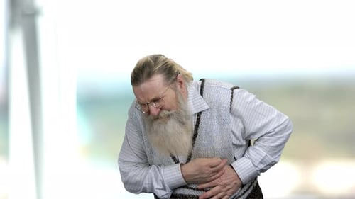 Senior Man Having Sudden Heart Attack.