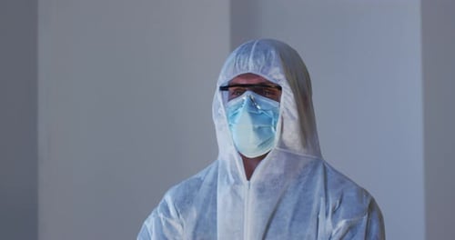 Health Worker in Hazmat Suit with Surgical Mask