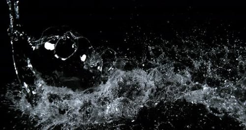 Abstract Shot of Splashing Clear Water on Black