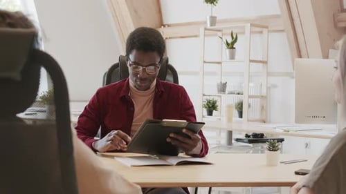 Young Adults Meet in a Modern Office Space