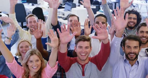 Portrait of business team gesturing together in office