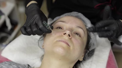 Cosmetologist Applies Peeling Lotion on Woman Face in Beauty Clinic Salon