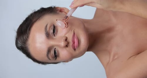 Vertical Video of Woman Using Natural Massager Tool for Skin Care and Spa Beauty Treatment