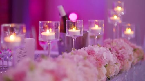 Wedding Table Decorated with Flowers and Candles