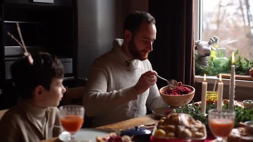 Family Celebrates Holiday with Festive Dinner at Home