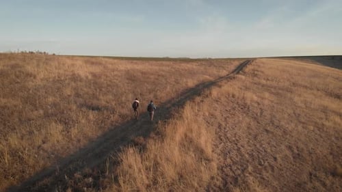 Aerial View Young Couple Together Take a Trip with Backpacks and Other Accessories To the Mountains