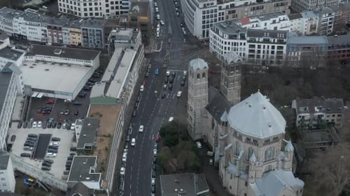 AERIAL: Slow Overhead Shot of Cologne City Central with Church in Germany