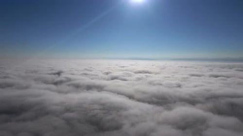 Majestic Aerial View of Clouds Under Blue Sky