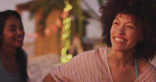 Mixed race woman enjoying on the beach