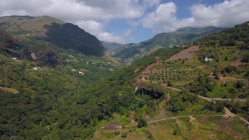 Aerial Mountain Gorge Hills Covered with Forest. Beautiful Mountain Landscape Sunny Weather in Italy