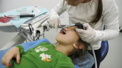 Child Receives Dental Care in a Hospital
