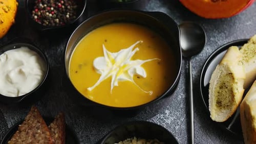 Pumpkin Soup with Cream and Herbs close up