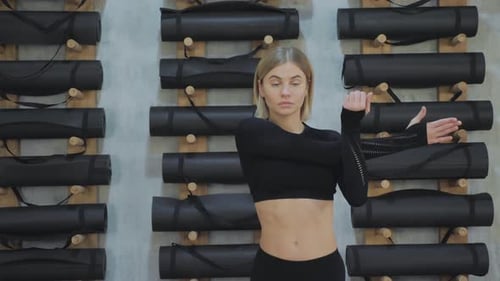 Close-up of A Young Girl Doing A Hand Warm-Up for a Workout, Stretching Her Muscles for a Workout