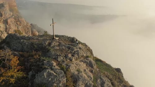 Mountain Top Cross Above the Clouds at Sunrise