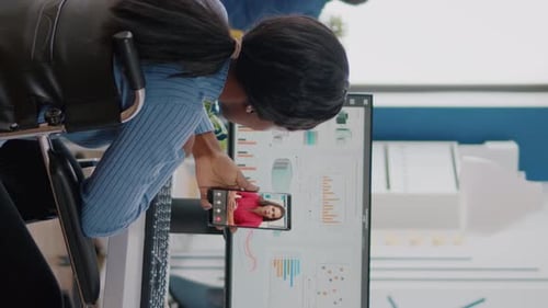 Woman in Wheelchair on Video Call in Office