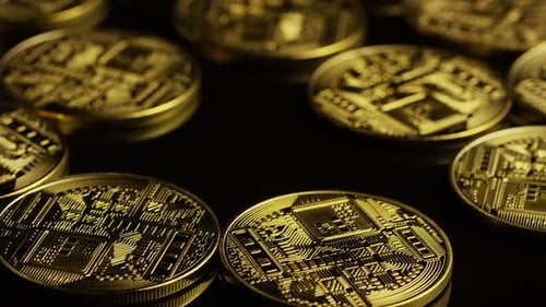 Rotating shot of Bitcoins (digital cryptocurrency) - BITCOIN