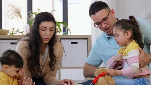 Family Playing Together with Toys Indoors