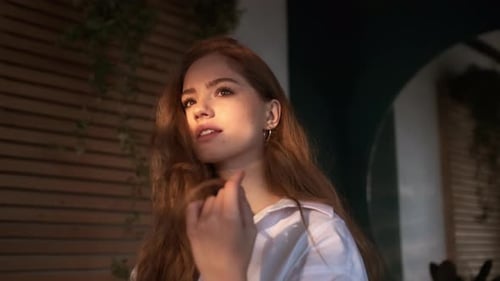 Glamorous Young Woman Posing in Golden Sunlight