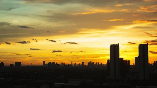 Time lapse sunset sunrise and beautiful twilight fluffy storm cloudy yellow sky