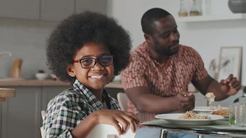 Portrait of Cute African American Boy at Family Dinner Table
