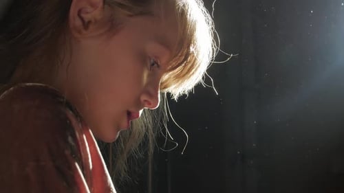 Child Face Close Up Illuminated by Soft Light