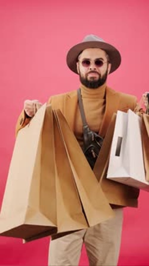 Black Friday Video Footage - A Man In A Shopping Spree Holding Many Shopping Bags