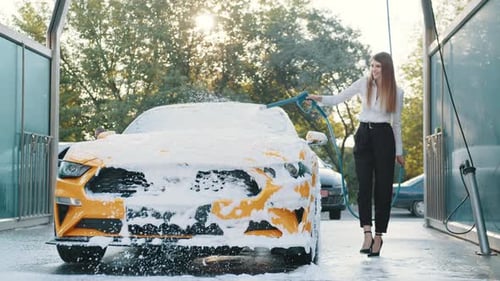 Washing of Modern Car on Open Air Self Car Wash Service with Foam and High