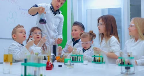 Kids in Lab Coats Doing Science Experiments