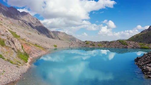 Clouds Reflection on Mirror Lake on Mountains in Switzerland