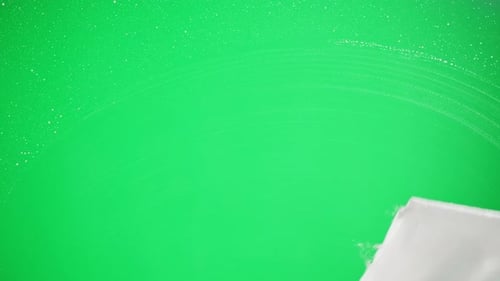Cleaning Glass Using Spray Detergent on Green Chroma Key Background