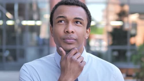 Man Thinking, Wearing a Shirt and Tie