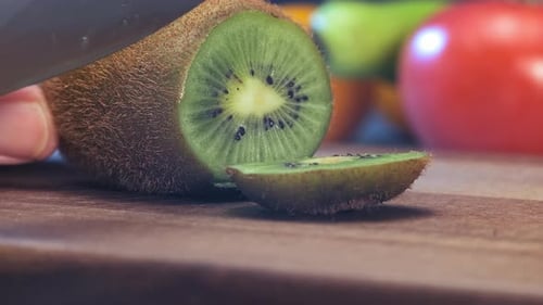 Kiwi Fruit Sliced on Cutting Board, Close Up