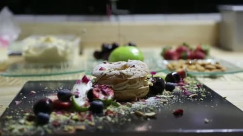 Pastry Chef Preparing Delicious Dessert in the Restaurant Kitchen