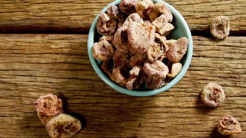 Dried figs on wooden table 4k