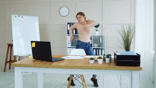 Happy Girl Dancing in Office
