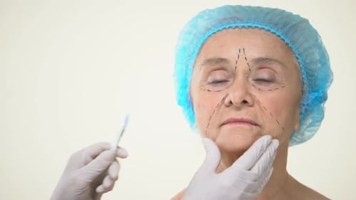 Senior Woman Receiving Cosmetic Surgery Consultation