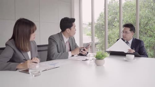 Professionals Have Meeting Using Tablet in Modern Office