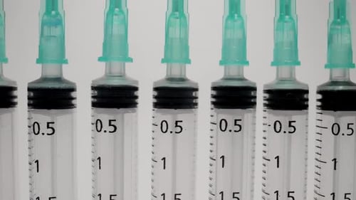 A Row of Medical Syringes