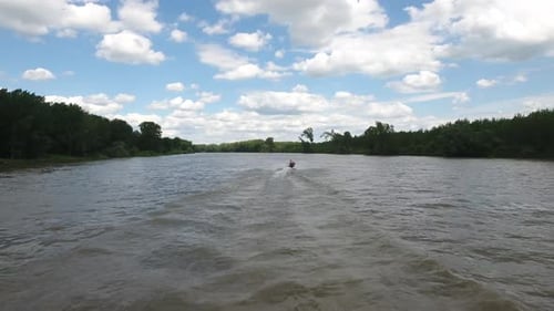 Aerial View of River with Distant Watercraft