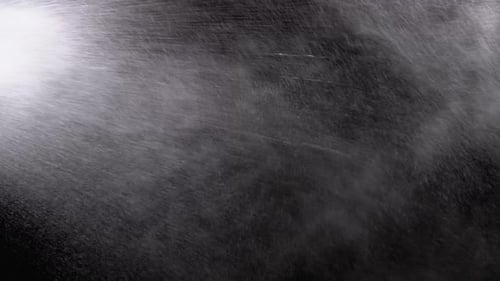 Water Droplets Spraying on Black Background