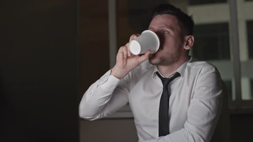 Sleepy Businessman Working at Night