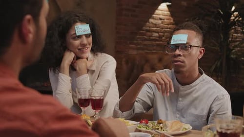 Young People Playing Funny Game during Meeting