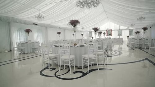 Elegant Wedding Venue with Tables and Decorations
