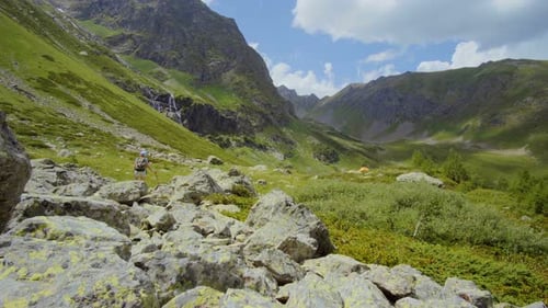 Woman Backpacker Hiking In Mountain 014
