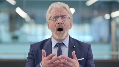 Surprised Mature Adult in Suit with Expression of Disbelief