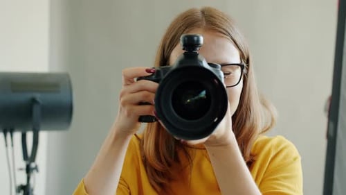 Woman Taking Photos with Digital Camera