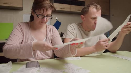 Married Couple Is Counting Expenses on Checks a Man Is Shocked