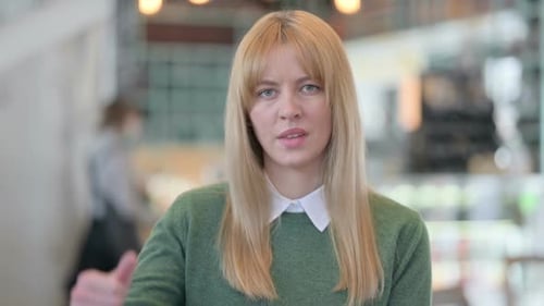 Woman Gives Thumbs Down